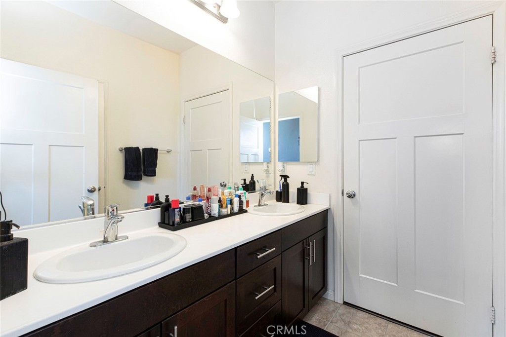 8656 Winnetka Avenue Winnetka, CA 91306 - Photo 16 of 31 a bathroom with a double vanity sink mirror and double