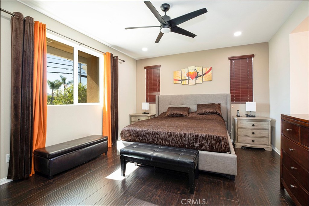 8656 Winnetka Avenue Winnetka, CA 91306 - Photo 18 of 31 a bedroom with a bed and wooden floor