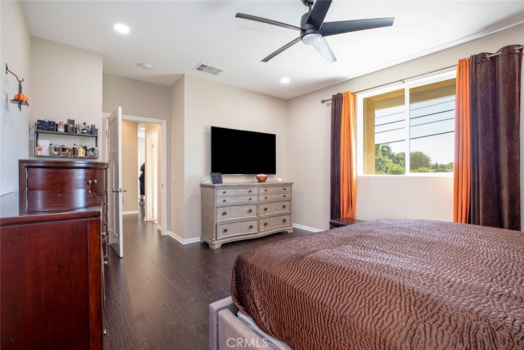 8656 Winnetka Avenue Winnetka, CA 91306 - Photo 19 of 31 a bedroom with a bed and a flat tv screen on a dresser