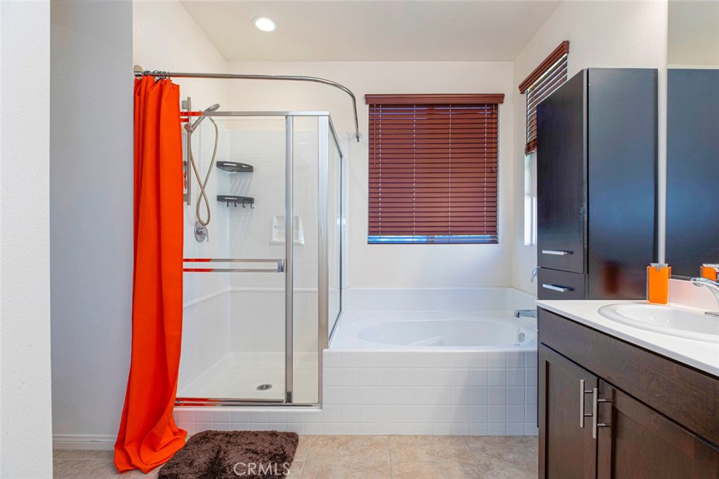 8656 Winnetka Avenue Winnetka, CA 91306 - Photo 21 of 31 a bathroom with a bathtub and a shower