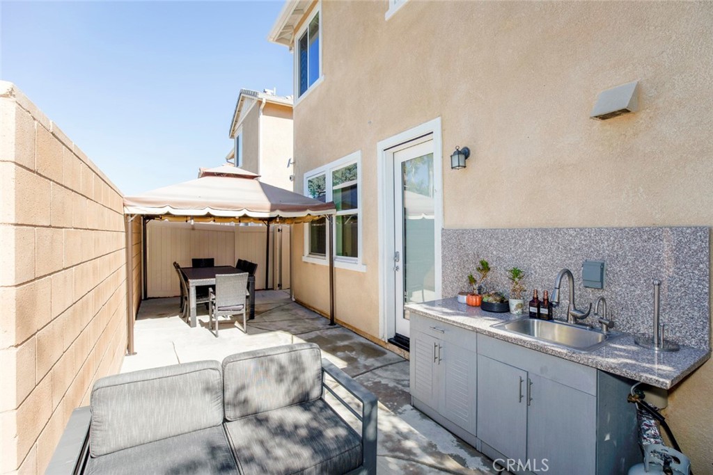 8656 Winnetka Avenue Winnetka, CA 91306 - Photo 24 of 31 a room with a sink and cabinets