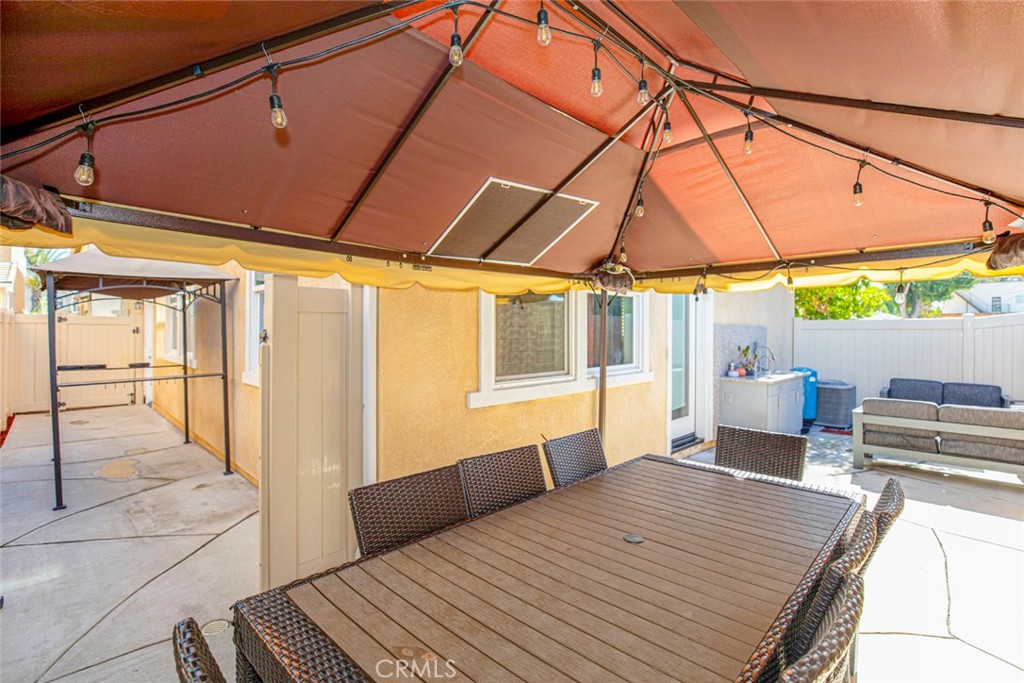 8656 Winnetka Avenue Winnetka, CA 91306 - Photo 26 of 31 a bedroom with a bed and large windows