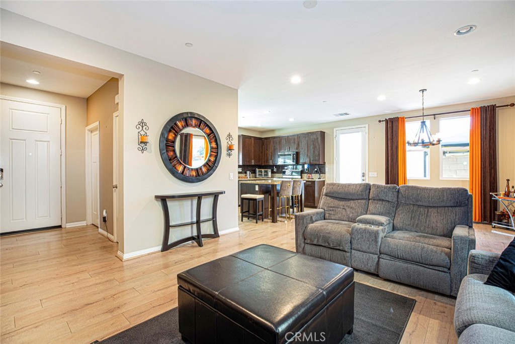 8656 Winnetka Avenue Winnetka, CA 91306 - Photo 6 of 31 a living room with furniture and a wooden floor