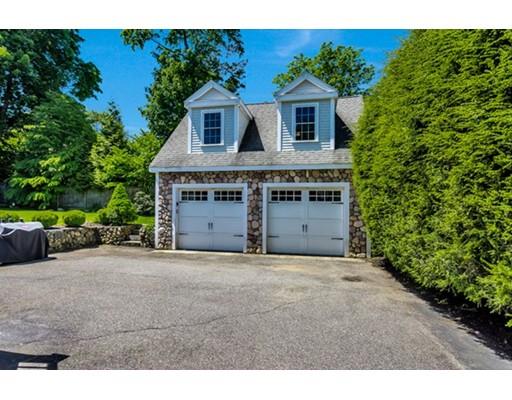 7 Ravine Road Winchester, MA 01890 - Photo 21 of 24 a view of a house with a yard and garage