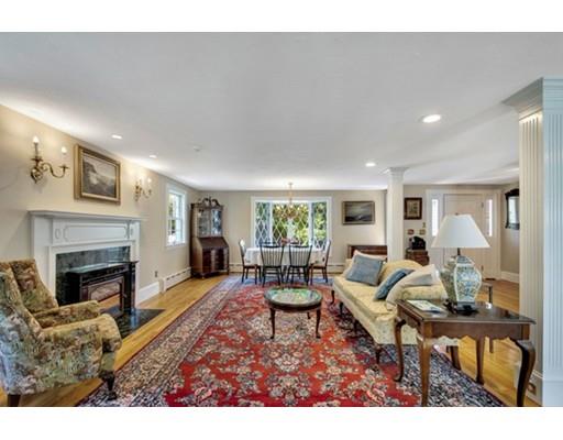 7 Ravine Road Winchester, MA 01890 - Photo 4 of 24 a living room with furniture a fireplace and a table