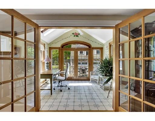 7 Ravine Road Winchester, MA 01890 - Photo 6 of 24 a view of an entryway with a floor to ceiling window and a living room