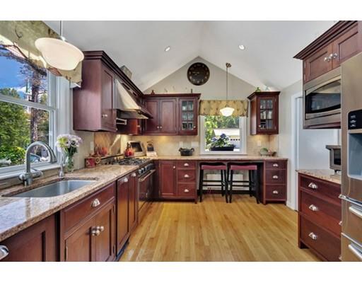 7 Ravine Road Winchester, MA 01890 - Photo 8 of 24 a kitchen with stainless steel appliances granite countertop a stove refrigerator and a sink