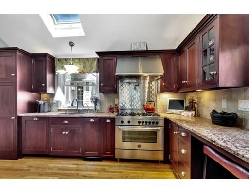 7 Ravine Road Winchester, MA 01890 - Photo 9 of 24 a kitchen with stainless steel appliances granite countertop a stove a sink and a refrigerator