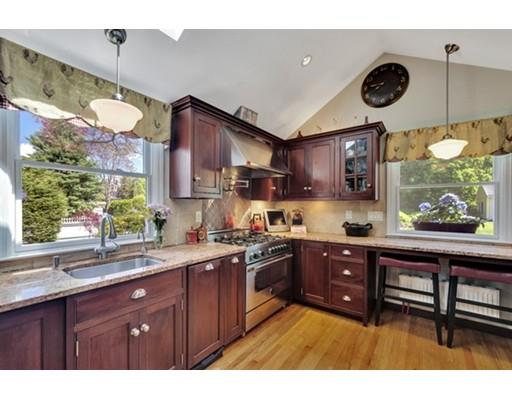 7 Ravine Road Winchester, MA 01890 - Photo 10 of 24 a kitchen with stainless steel appliances granite countertop a stove a sink and a microwave