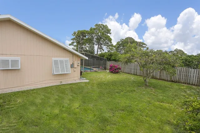 a backyard of a house with lots of green space