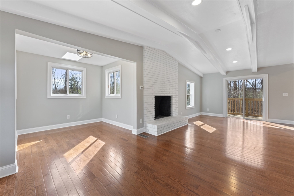 224 Three Rivers Road Wilbraham, MA 01095 - Photo 8 of 26 a view of an empty room with wooden floor and a window