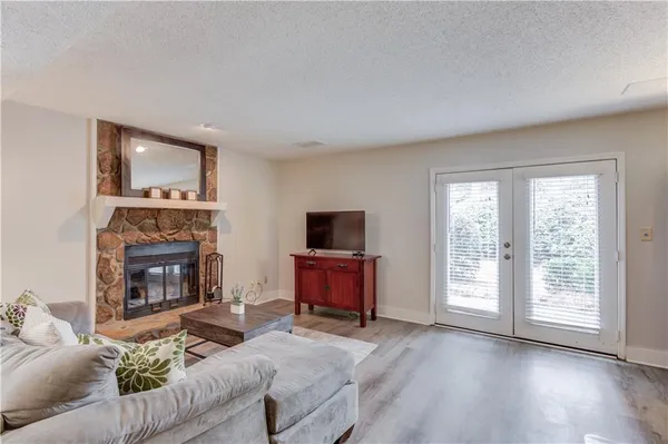 a living room with furniture and a fireplace