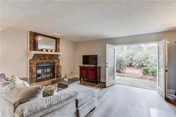 a living room with furniture and a fireplace