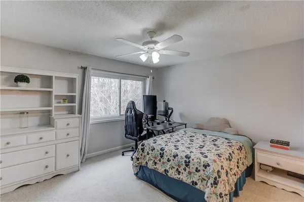 a bedroom with a bed and furniture