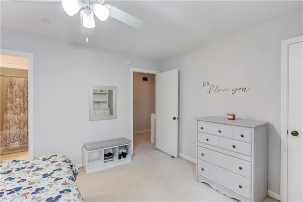 a bedroom with a bed and a dresser