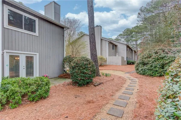 a front view of a house with garden