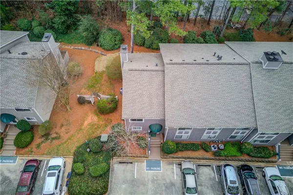 an aerial view of a house with a yard