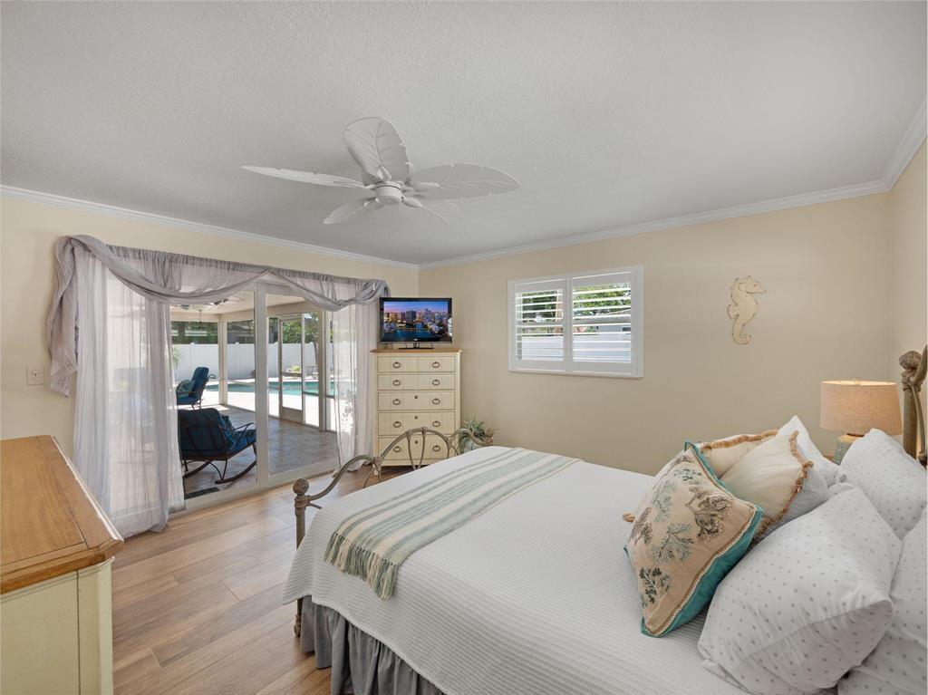 2250 Northeast 35th Street Lighthouse Point, FL 33064 - Photo 17 of 26 a bedroom with a large bed and a window