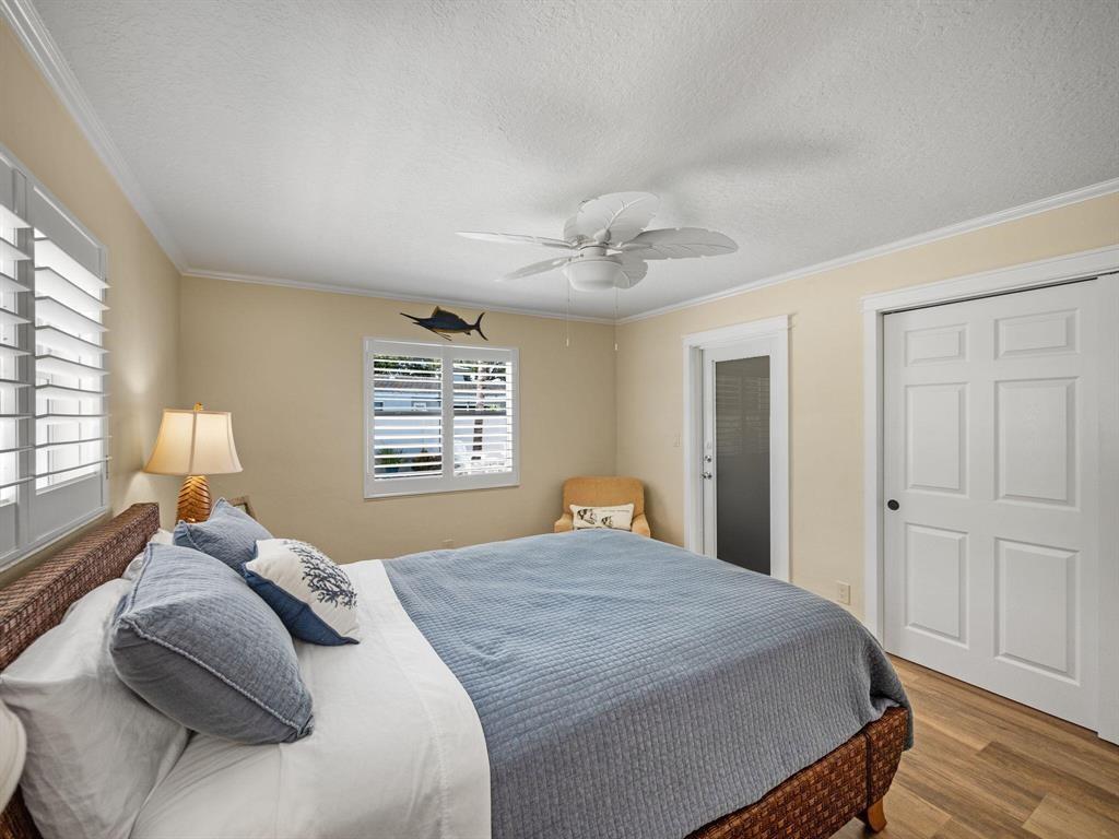 2250 Northeast 35th Street Lighthouse Point, FL 33064 - Photo 20 of 26 a bedroom with a large bed and a window