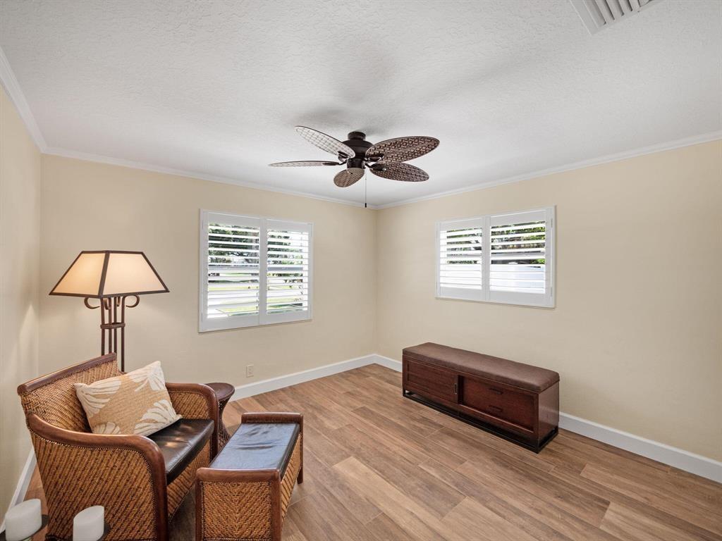 2250 Northeast 35th Street Lighthouse Point, FL 33064 - Photo 22 of 26 a living room with furniture and a window