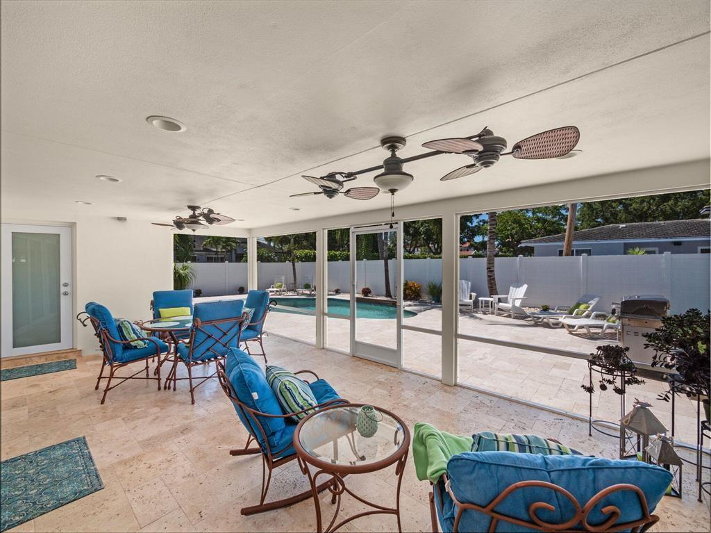 2250 Northeast 35th Street Lighthouse Point, FL 33064 - Photo 8 of 26 a living room with furniture and a floor to ceiling window