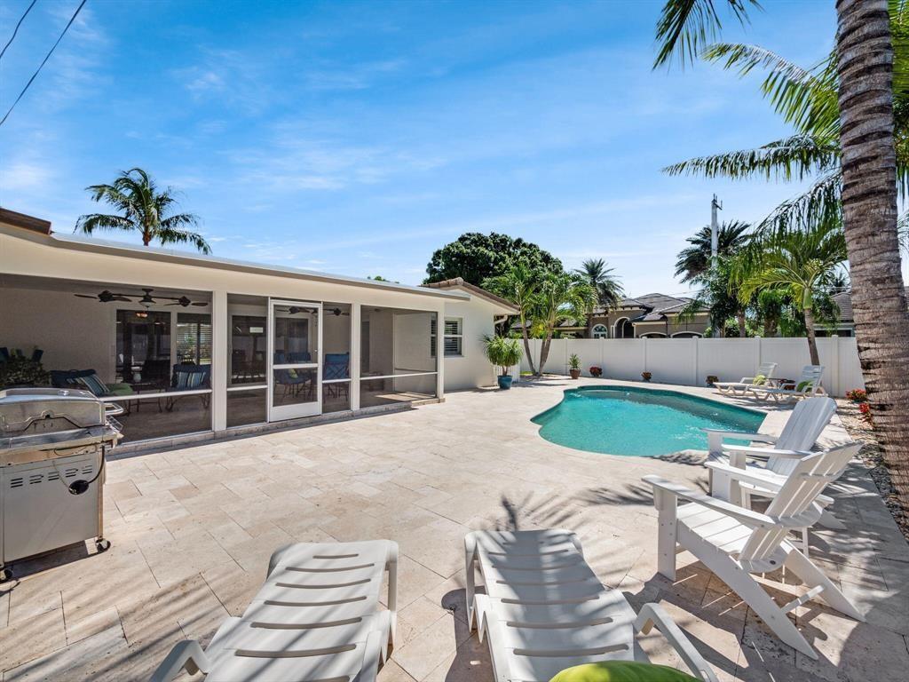 2250 Northeast 35th Street Lighthouse Point, FL 33064 - Photo 10 of 26 a view of a house with backyard porch and sitting area