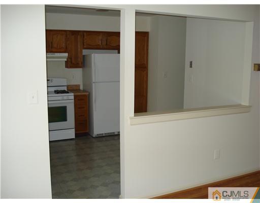 604 Timber Oaks Road Edison, NJ 08820 - Photo 11 of 18 a kitchen with a refrigerator and a stove