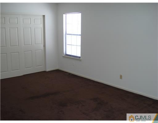 604 Timber Oaks Road Edison, NJ 08820 - Photo 15 of 18 an empty room with a window