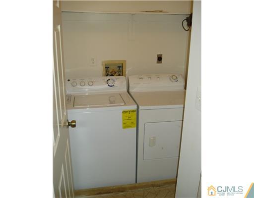 604 Timber Oaks Road Edison, NJ 08820 - Photo 18 of 18 a bathroom with a sink and a window