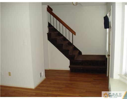 604 Timber Oaks Road Edison, NJ 08820 - Photo 7 of 18 a view of entryway with wooden floor