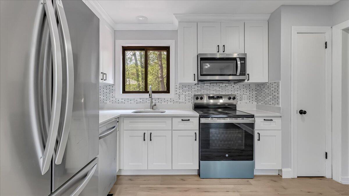 7198 Rimrock Drive Tobyhanna, PA 18466 - Photo 15 of 38 a kitchen with stainless steel appliances granite countertop a refrigerator and a sink