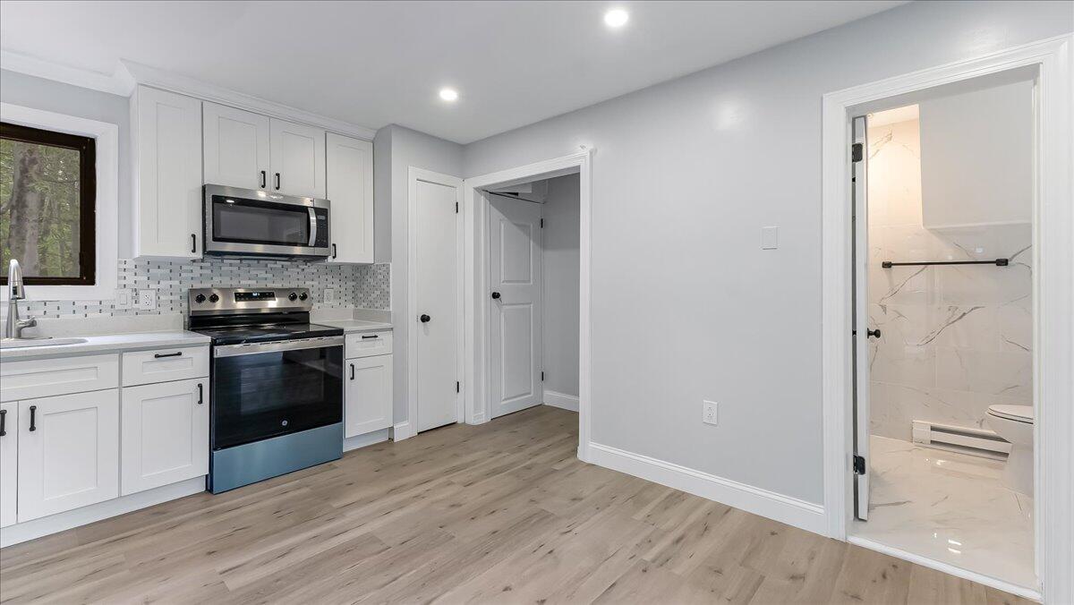 7198 Rimrock Drive Tobyhanna, PA 18466 - Photo 16 of 38 a kitchen with a refrigerator and a stove top oven