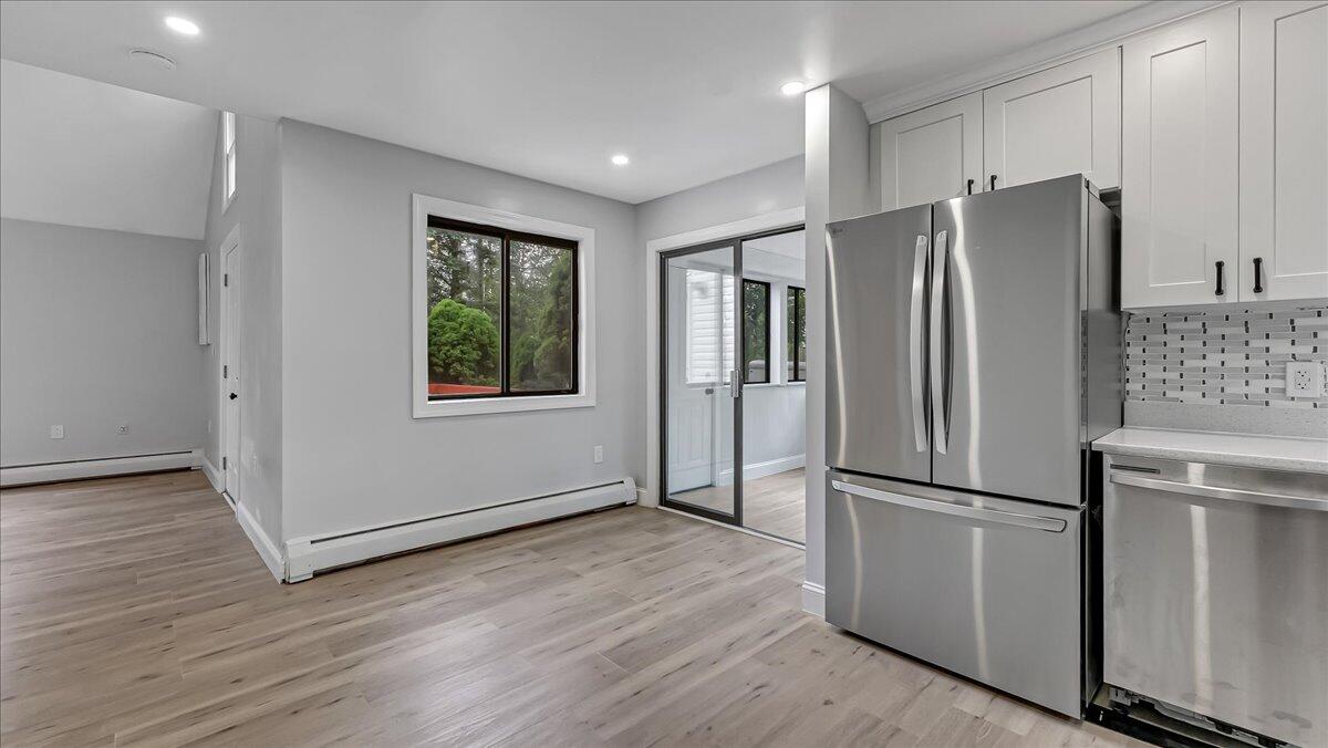 7198 Rimrock Drive Tobyhanna, PA 18466 - Photo 17 of 38 a kitchen with stainless steel appliances a refrigerator and wooden floor