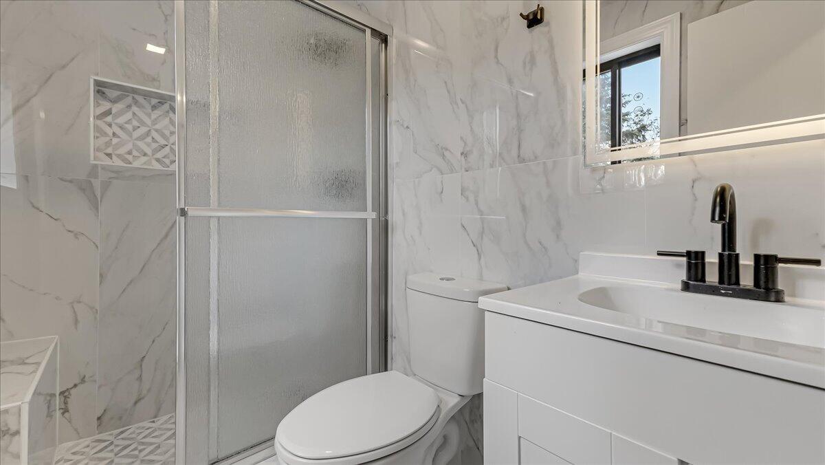 7198 Rimrock Drive Tobyhanna, PA 18466 - Photo 27 of 38 a bathroom with a sink toilet and shower