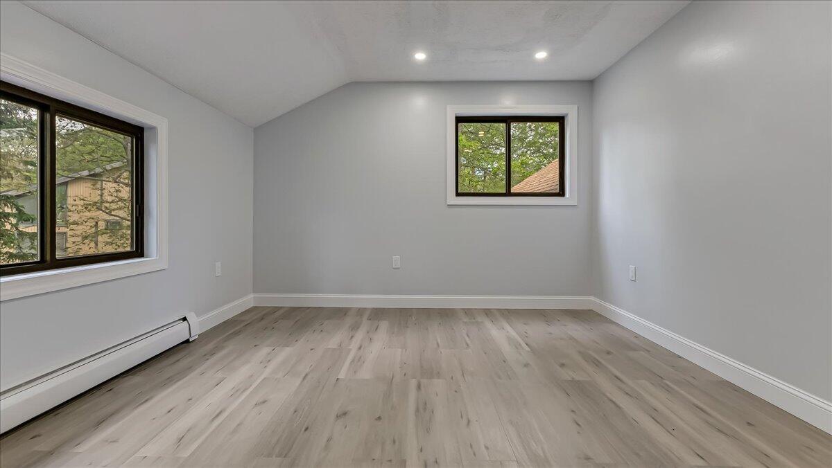 7198 Rimrock Drive Tobyhanna, PA 18466 - Photo 29 of 38 an empty room with wooden floor and windows