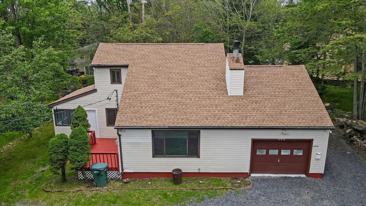 7198 Rimrock Drive Tobyhanna, PA 18466 - Photo 3 of 38 a view of a house with a yard and garage