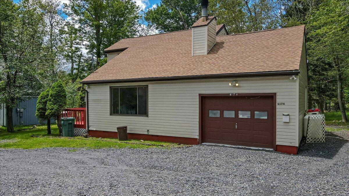 7198 Rimrock Drive Tobyhanna, PA 18466 - Photo 5 of 38 a front view of a house with garden