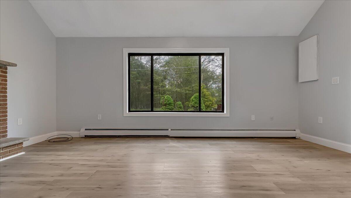 7198 Rimrock Drive Tobyhanna, PA 18466 - Photo 10 of 38 wooden floor and window in an empty room