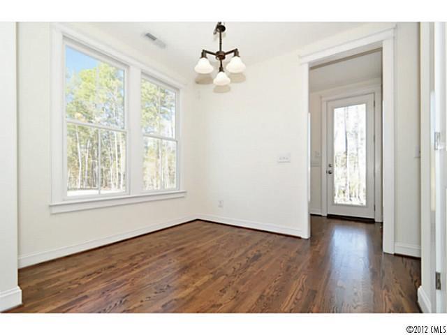 3486 Richard's Crossing Fort Mill, SC 29708 - Photo 11 of 16 a view of an empty room with wooden floor and a window