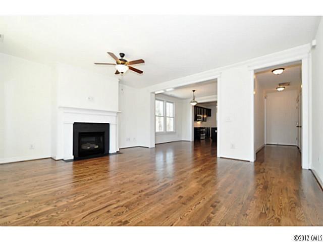 3486 Richard's Crossing Fort Mill, SC 29708 - Photo 4 of 16 a view of empty room with wooden floor and fireplace