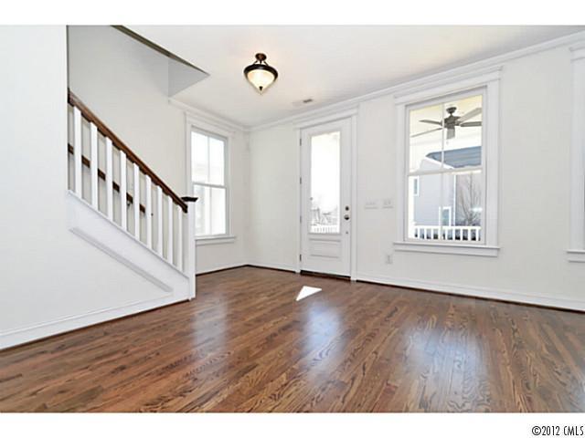 3486 Richard's Crossing Fort Mill, SC 29708 - Photo 6 of 16 a view of an empty room with wooden floor and windows