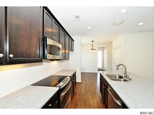 3486 Richard's Crossing Fort Mill, SC 29708 - Photo 8 of 16 a kitchen with stainless steel appliances granite countertop a sink stove and cabinets