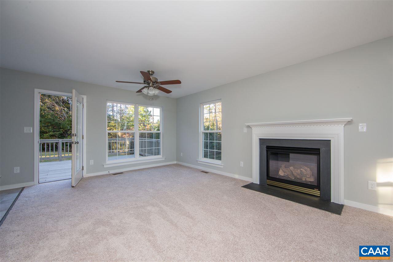 2047 Campbell Road Keswick, VA 22947 - Photo 17 of 39 a view of an empty room with a fireplace