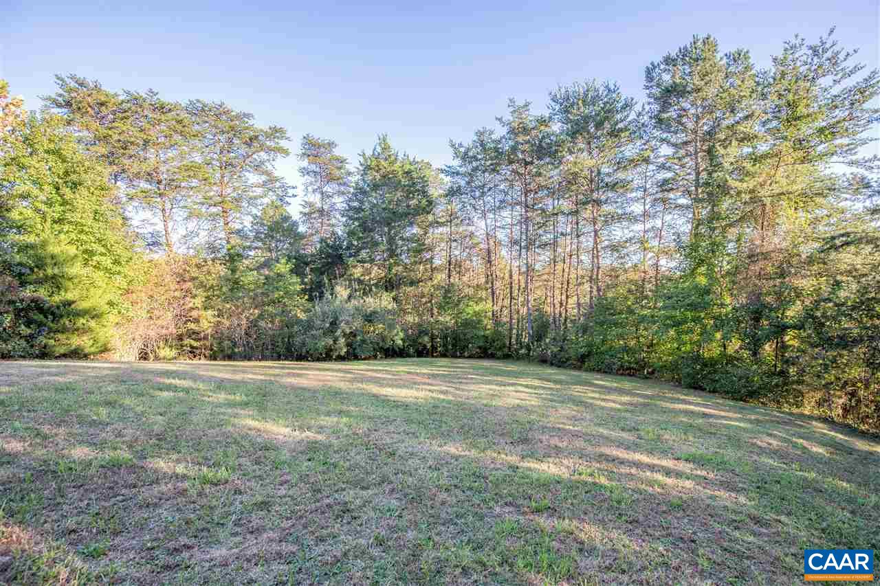 2047 Campbell Road Keswick, VA 22947 - Photo 36 of 39 a view of a field with trees in the background