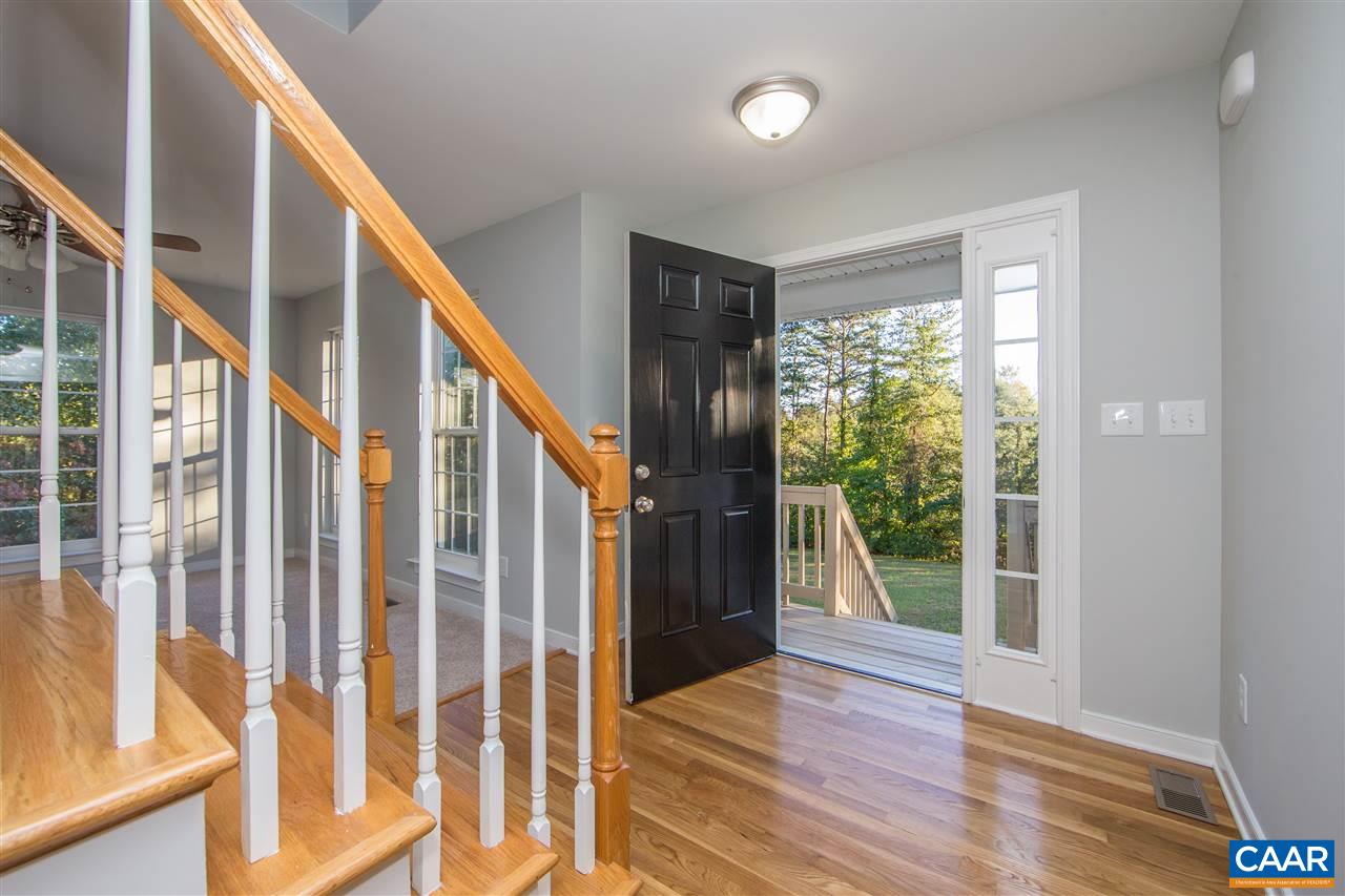 2047 Campbell Road Keswick, VA 22947 - Photo 4 of 39 a view of an entryway with wooden floor and door