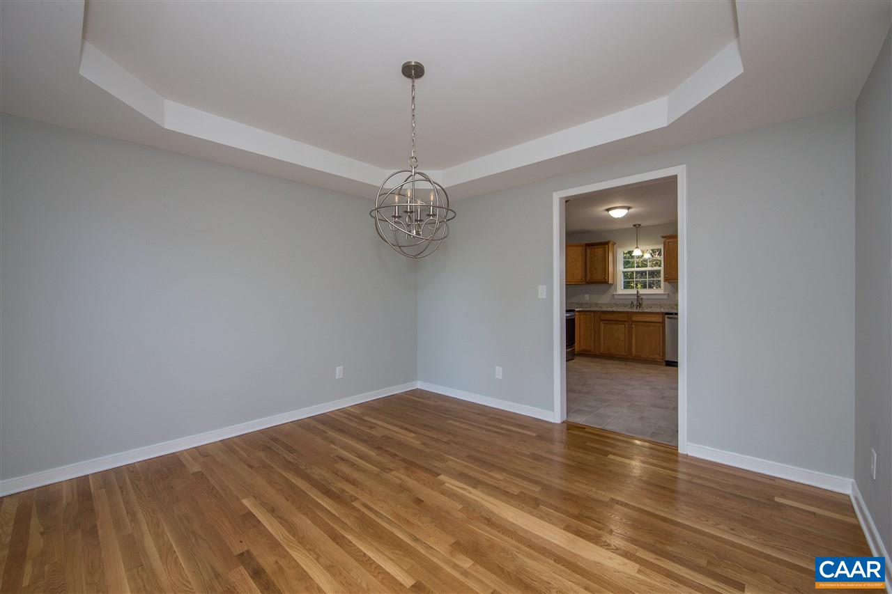 2047 Campbell Road Keswick, VA 22947 - Photo 7 of 39 a view of a room with wooden floor and a ceiling fan