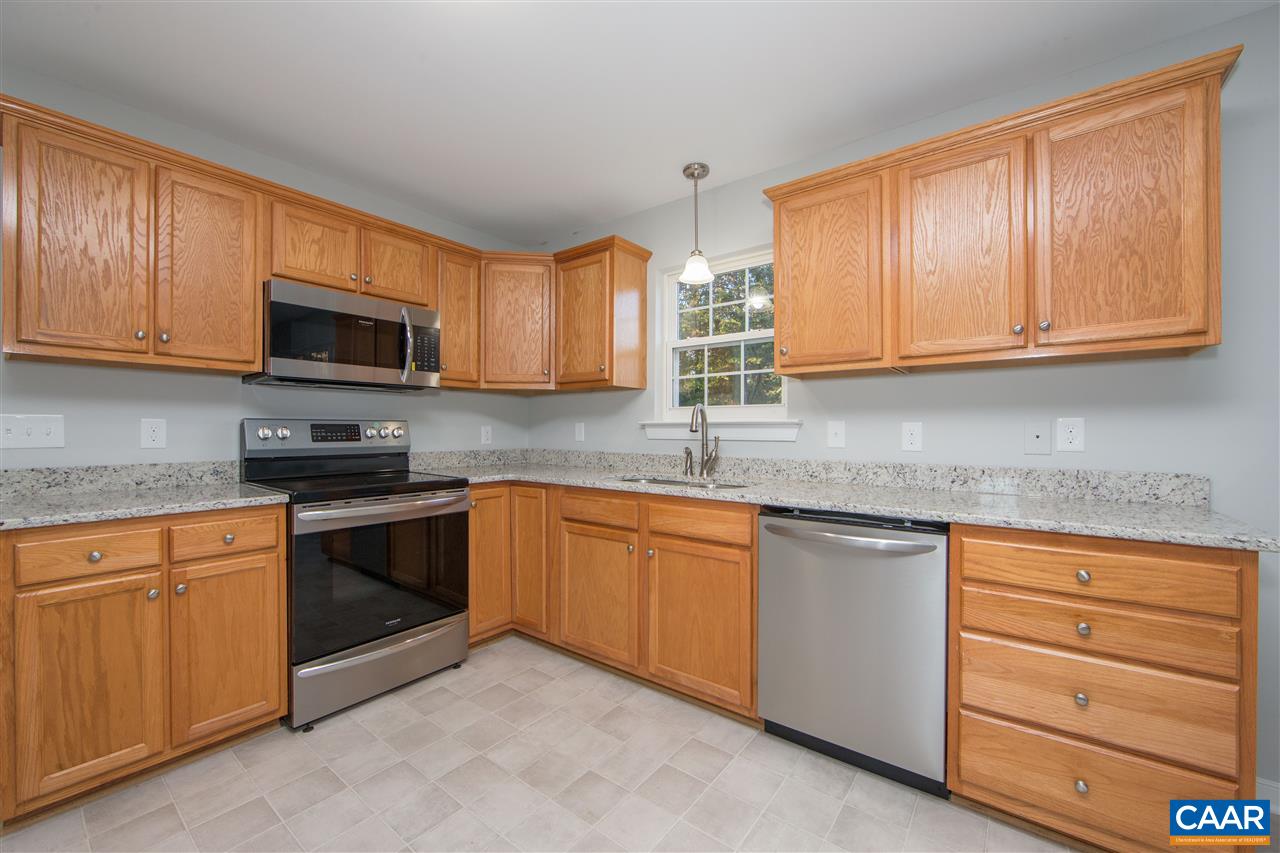 2047 Campbell Road Keswick, VA 22947 - Photo 10 of 39 a kitchen with granite countertop cabinets stainless steel appliances and a sink