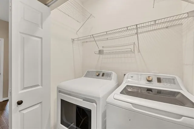 a utility room with dryer and washer