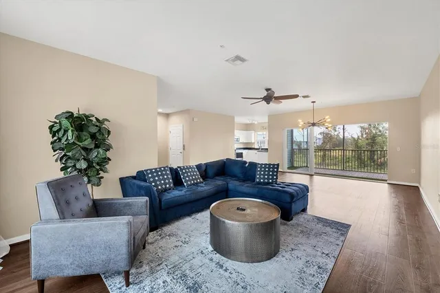 a living room with furniture and a large window