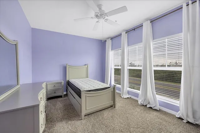 a bedroom with furniture and a window